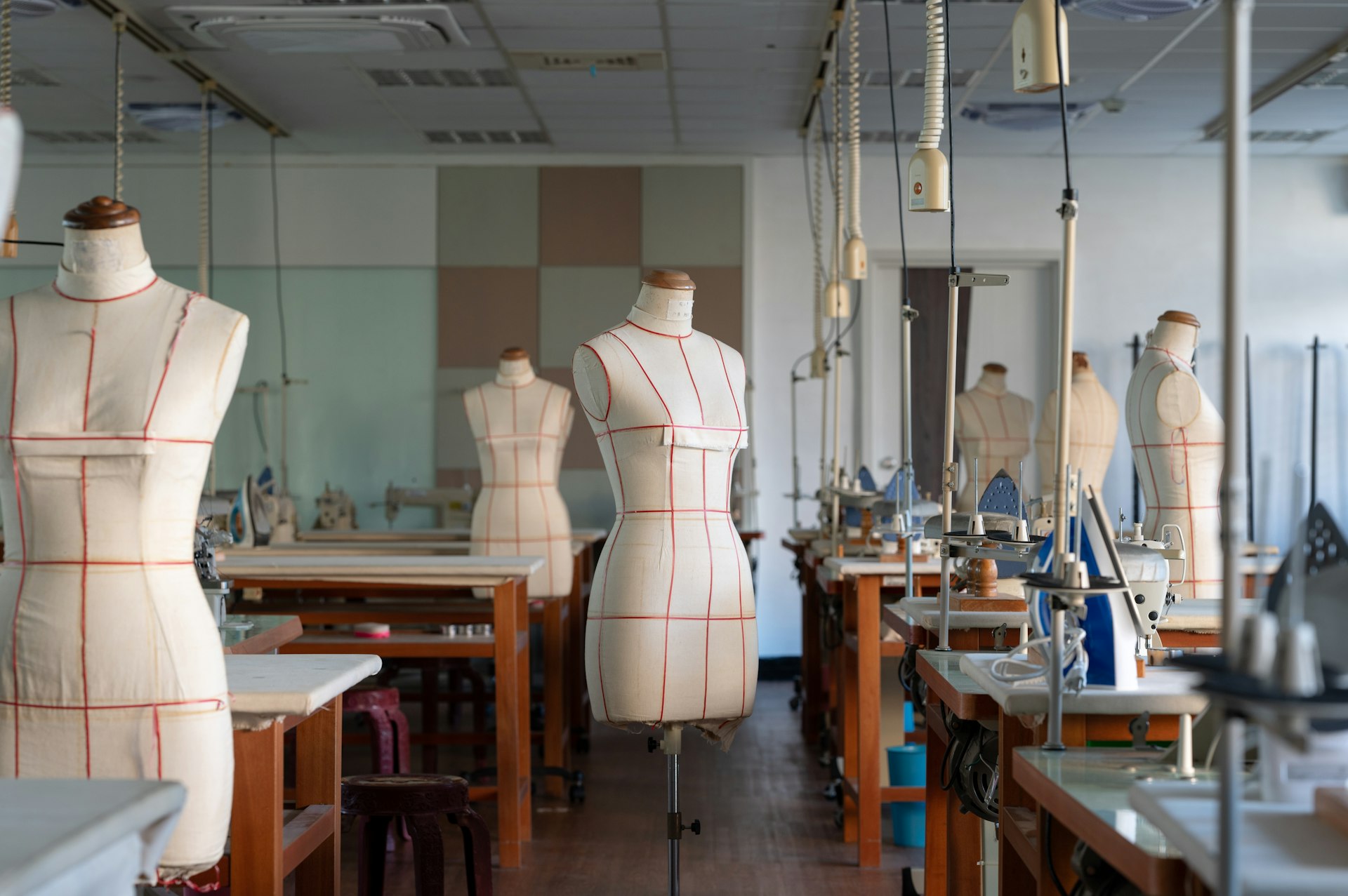 Bikini design workshop with dress forms and sewing equipment – creative swimwear studio